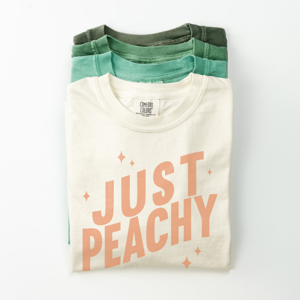 Stack of four t-shirts.